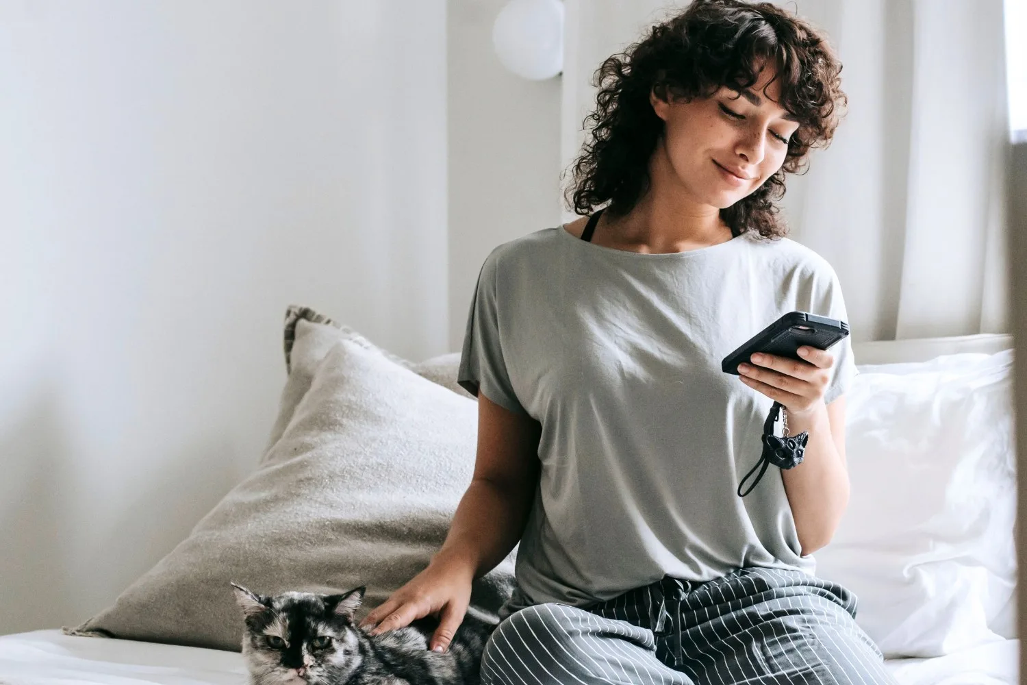 Woman relaxing with her cat at home